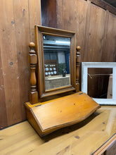 Load image into Gallery viewer, A charming pine dressing table mirror with practical appeal. Structurally sound and in good overall condition, this piece bears the gentle patina of use with only minor surface marks. The ingenious lift-up base conceals convenient storage space, making it both functional and characterful for any bedroom or dressing area.

Delivery Available

Overall Dimensions

51cm wide x 26cm deep x 62cm high&nbsp;

