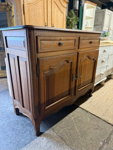 This elegant oak sideboard is in excellent structural condition and overall good shape. Although it is pre-owned and may have a few marks, they are minor and do not detract from its beauty. The sideboard features two dovetail jointed drawers on top of a double cupboard with one internal shelf. It also includes two keys for added convenience.

Overall Dimensions

114cm wide x 49cm deep x 95cm high

DELIVERY AVAILABLE      

HAVE THIS PAINTED A COLOUR OF YOUR CHOICE FOR AN EXTRA £80 OR HAVE IT COMPLETELY STRI