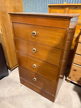 Load image into Gallery viewer, This striking mid-century tallboy combines vintage character with practical storage. Structurally sound and in good overall condition, it features four spacious dovetail-jointed drawers beneath a mirrored vanity section—perfect for bedroom or dressing room use. Light surface marks add to its authentic period appeal. A timeless piece that brings mid-century style and functionality to any space.

Delivery Available

Overall Dimensions

63.5cm wide x 42cm deep x 104.5cm high

