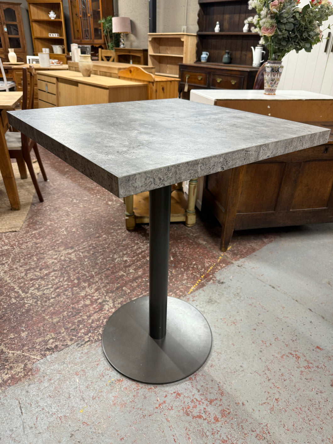 This sturdy bar table features a heavy concrete effect and is in good overall condition. Though it shows some signs of use, the marks are minor. It’s an ideal choice for those looking to save space without compromising style.

Delivery Available

Overall Dimensions

70cm wide x 70cm deep x 92cm high 
