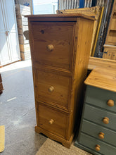 Load image into Gallery viewer, This sturdy solid pine tallboy is in great shape overall. While it shows a few marks, they don’t impact its functionality. It features three spacious drawers with durable dovetail joints.

Overall Dimensions

45cm wide x 45.5cm deep x 124cm high

DELIVERY AVAILABLE      

HAVE THIS PAINTED A COLOUR OF YOUR CHOICE FOR AN EXTRA £70 OR HAVE IT COMPLETELY STRIPPED BACK FOR JUST £80    

For our other items see our website https://fossewayfurniture.co.uk

collection from our shop at cv36, our collection zone at 
