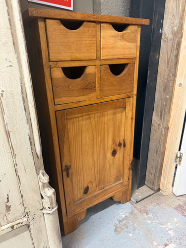 This charming rustic solid pine cupboard is sturdy and generally well maintained. It shows some signs of use with a few minor marks, but nothing significant. Featuring four small drawers and one cupboard, it offers practical storage space.

Delivery Available

Overall Dimensions

45.5cm wide x 26cm deep x 90cm high 
