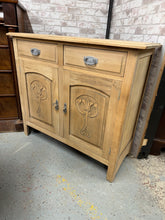 Load image into Gallery viewer, This satinwood sideboard showcases its natural finish after being stripped back to bare wood. Two dovetail-jointed drawers sit above a double cupboard with a single shelf inside, providing ample storage space. The furniture is in solid working condition with only light marks on the surface. A protective wax application will enhance and preserve the wood.&nbsp;

Delivery Available

Overall Dimensions

104.5cm wide x 42.5cm deep x 92.5cm high&nbsp;

