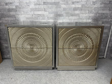 Load image into Gallery viewer, A pair of striking geometric bedsides that combine contemporary style with reliable functionality. Both pieces showcase excellent structural integrity and are well-maintained despite their pre-loved status. Minor cosmetic marks are present. The standout feature is the pristine bevelled-edge glass tops, which remain in exceptional condition.&nbsp;

Delivery Available

Overall Dimensions

60cm wide x 40cm deep x 67cm high&nbsp; &nbsp; &nbsp; &nbsp;&nbsp;

