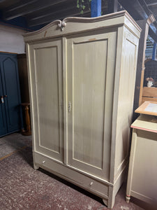 This charming antique pine wardrobe has been painted gloss white by its previous owners, featuring a lovely pink and blue top. Its attractive distressed finish makes it ideal for vintage lovers. It provides generous storage with a hanging rail and a long dovetail-jointed drawer. A minor repair inside one door has been made, but it doesn’t affect its function.

Overall Dimensions

125cm wide x 57cm deep x 188cm high

DELIVERY AVAILABLE      

For our other items see our website https://fossewayfurniture.co.u