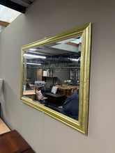 Load image into Gallery viewer, A beautiful gold-framed mirror featuring bevelled edges and solid construction. This pre-loved piece shows gentle signs of use with minor surface marks. Perfect for adding warmth and elegance to any room.

Delivery Available

Overall Dimensions

104cm x 73cm

