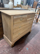 Load image into Gallery viewer, This charming satinwood chest of drawers combines solid construction with timeless appeal. Stripped back to reveal its natural beauty, the piece showcases quality dovetail joinery across four spacious drawers—two shallow and two deep—offering versatile storage. Structurally sound and in excellent condition, it's ready for finishing with wax or your preferred protective coating to enhance and preserve the wood's warm patina.

Delivery Available

Overall Dimensions

107cm wide x 42.5cm deep x 84cm high&nbsp;

