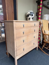 Load image into Gallery viewer, Stripped oak chest featuring four spacious dovetail-jointed drawers. Returned to natural wood finish, revealing the grain and character of oak. Light surface marks add to its vintage appeal. A protective wax coat is recommended to enhance durability and bring out the wood's warmth. Ideal for those seeking genuine, unfinished furniture with timeless charm.

Delivery Available

Overall Dimensions

91cm wide x 40.5cm deep x 100cm high&nbsp;

