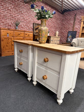 Load image into Gallery viewer, A charming pair of solid pine bedside tables with authentic character. Finished in white by their previous owners they do have some marks so perfect for refininshing. Structurally sound throughout, each unit features two dovetail-jointed drawers offering practical storage. Ideal for those seeking genuine vintage furniture with solid craftsmanship and room for personalisation.

Delivery Available

Overall Dimensions

57.5cm wide x 40cm deep x 64cm high&nbsp;

