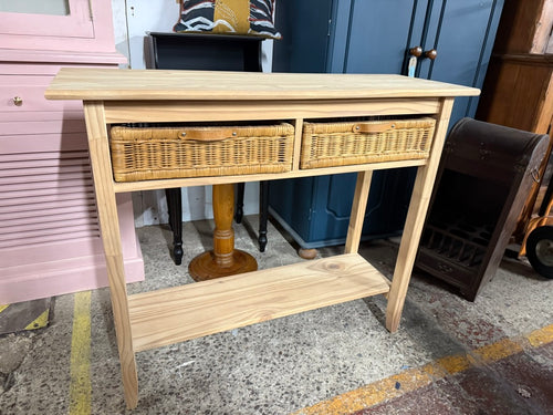 This charming pine console table has been fully restored to showcase its natural beauty. Adding a layer of wax will help protect it further. It features two wicker drawers and a convenient lower shelf, perfect for extra storage.

Overall Dimensions

99.5cm wide x 35cm deep x 84cm high

DELIVERY AVAILABLE      

For our other items see our website https://fossewayfurniture.co.uk

collection from our shop at CV36 4QZ or purchase online for delivery.
