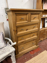 Load image into Gallery viewer, A charming solid pine drawer unit offering practical storage with character. This well-maintained piece features two shallow drawers above three generous deep drawers, perfect for organising bedrooms, living spaces, or home offices. The wood construction shows gentle signs of age and use, adding authentic vintage appeal. Sturdy and reliable, it combines functionality with timeless style.

Delivery Available

Overall Dimensions

92cm wide x 48cm deep x 131cm high

