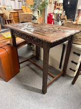 Load image into Gallery viewer, This striking Victorian oak carved table brings timeless elegance to any space. Structurally sound and well-maintained, it bears the natural patina of age—subtle marks that add character rather than detract from its beauty. The intricate carved detailing showcases authentic craftsmanship, making it an excellent focal point for entryways, hallways, or living areas.&nbsp;

Delivery Available

Overall Dimensions

85cm wide x 58cm deep x 72.5cm high

