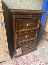 Load image into Gallery viewer, A characterful solid wood bedside table by Reclaimed, featuring authentic patina from its pre-loved history. Three dovetail-jointed drawers offer practical storage, while a pull-out tray adds versatile functionality. Minor surface marks enhance its vintage appeal. Structurally sound and ready for years of use.

Delivery Available

Overall Dimensions

46.5cm wide x 37cm deep x 74.5cm high

