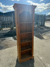 Load image into Gallery viewer, This sturdy narrow pine bookcase is well-built and remains in good shape. While it shows some minor marks from use, they are hardly noticeable. It features 4 spacious shelves, perfect for organising your books and treasures.

Overall Dimensions

61cm wide x 30cm deep x 173cm high

DELIVERY AVAILABLE      

HAVE THIS PAINTED A COLOUR OF YOUR CHOICE FOR AN EXTRA £90 OR HAVE IT COMPLETELY STRIPPED BACK FOR JUST £100    

For our other items see our website https://fossewayfurniture.co.uk

collection from our s
