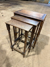 Load image into Gallery viewer, A charming three-piece oak nesting set with one large table and two smaller companions in different finishes. Perfect for an eclectic style, these sturdy pieces are in overall good condition with only minor marks that add character. Stack them together or display separately for flexible, versatile living.

Delivery Available

Overall Dimensions

largest table : 43cm wide x 28cm deep x 57cm high&nbsp;
