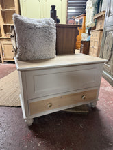 Load image into Gallery viewer, A charming two-tone blanket box in light grey and natural wood, offering dual storage through a hinged top compartment and lower drawer. Structurally sound with minor cosmetic marks that add character. Perfect for bedrooms or living spaces, and an ideal canvas for a fresh paint refresh to suit your décor style.

Delivery Available

Overall Dimensions

85cm wide x 46cm deep x 57cm high

