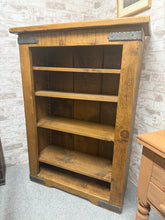 Load image into Gallery viewer, A charming rustic wooden bookcase with solid construction and character. Four spacious shelves offer ample display space for books, décor, and collectibles. Light wear and patina enhance its authentic vintage appeal, making it a distinctive addition to any room with farmhouse or traditional styling.

Delivery Available

Overall Dimensions

90cm wide x 38cm deep x 127cm high

