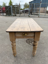 Load image into Gallery viewer, This elegant antique pine dining table offers both style and functionality. Despite its age, it remains in excellent condition and features two convenient storage drawers at each end. Any imperfections only add to its unique character.

Overall Dimensions

137cm long x 65cm wide x 76cm high

DELIVERY AVAILABLE      

For our other items see our website https://fossewayfurniture.co.uk

collection from our shop at cv36, our collection zone at bs36 or otherwise delivery is available

