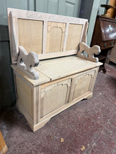 Load image into Gallery viewer, This stripped oak monks bench showcases natural wood grain with honest patina marks that add character rather than detract from it. The piece is structurally robust and ready for use as-is, though a protective wax finish would enhance durability. The hinged lid opens to reveal practical storage space, whilst the backrest folds flat for versatility. A genuine vintage find with functional appeal and room to personalise through finishing if desired.

Delivery Available

Overall Dimensions

95.5cm wide x 43cm d
