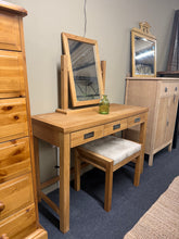 Load image into Gallery viewer, Elegant oak dressing table set featuring a spacious mirror and matching stool. Three practical drawers provide ample storage for cosmetics, jewellery, and accessories. Pre-loved with light surface marks that add character; structurally sound and fully functional. A timeless piece that combines style with everyday utility for your bedroom or dressing room.

Delivery Available

Overall Dimensions

table measurements : 110cm wide x 45cm deep x 75cm high

