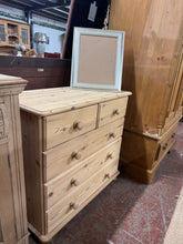 Load image into Gallery viewer, Authentic solid pine chest featuring traditional dovetail joinery—2 short drawers over 3 long for generous storage. Stripped to natural wood, ready for your finishing touch with wax or oil to enhance the grain and protect the surface. Vintage character with honest wear marks that add to its charm. A timeless piece for any bedroom or hallway.

Delivery Available

Overall Dimensions

85cm wide x 42cm deep x 80cm high

