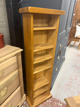 Load image into Gallery viewer, A narrow oak bookcase with six shelves, perfect for displaying books and décor in tight spaces. Structurally sound with minor cosmetic marks that add character. Ideal for bedrooms, home offices, or living areas where floor space is limited.

Delivery Available

Overall Dimensions

36cm wide x 20cm deep x 115cm high

