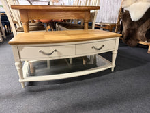 Load image into Gallery viewer, A charming two-tone coffee table with rustic country appeal. Built to last, this piece shows minor cosmetic wear but remains in solid working order. Features a practical lower glass shelf and two convenient drawers, offering ample storage space for living room essentials.&nbsp;

Delivery Available

Overall Dimensions

109cm wide x 64.5cm deep x 46cm high

