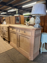 Load image into Gallery viewer, A characterful stripped sideboard with solid construction and vintage charm. This piece combines practical storage with period appeal—featuring two drawers, a double cupboard, and a clever hidden push-pop drawer for discreet storage. Light surface marks add to its authentic character. Includes original key. A versatile addition to hallways, living rooms, or dining spaces seeking traditional style with real substance.

Delivery Available

Overall Dimensions

144cm wide x 50cm deep x 99cm high

