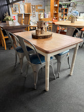 Load image into Gallery viewer, A charming pine dining table finished in Farrow &amp; Ball's 'Slipper Satin' — a soft, sophisticated neutral that complements any interior. The top has been sanded and waxed to a subtle sheen. This pre-loved piece bears gentle signs of use that add to its character. Seats 4–6 comfortably, making it ideal for family meals and entertaining.

Delivery Available

Overall Dimensions

122cm long x 76cm wide x 73.5cm high

