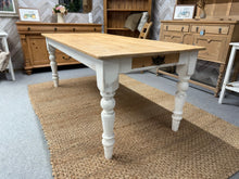 Load image into Gallery viewer, Bring warmth and character to your dining space with this charming solid pine table, featuring beautifully weathered legs that showcase authentic rustic appeal. The natural pine surface pairs perfectly with its practical front-facing drawer, while sturdy fixed legs ensure lasting stability. Comfortably accommodating six to eight guests, it&#39;s an ideal centrepiece for family gatherings and memorable meals.

Overall Dimensions

183cm long x 85cm wide x 73cm high

DELIVERY AVAILABLE      

For our other items s

