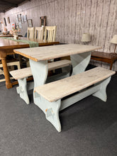 Load image into Gallery viewer, Charming pine dining set featuring a sturdy table and matching benches, perfect for seating four. This piece has some minor surface marks such as slight chewing marks and a panel that needs slight attention to the table top but nothing major. The construction remains fully functional, making it an excellent choice for those seeking rustic appeal with practical everyday use. Ideal for families or smaller dining spaces seeking warmth and durability.

Delivery Available

Overall Dimensions

table : 100cm long 
