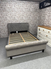 Load image into Gallery viewer, This elegant grey fabric double sleigh bed is sturdy and in excellent condition overall. Despite some minor markings on the footboard it is in good condition. As a bonus this is easy to assemble.

Overall Dimensions

142cm wide x 213cm long x 35cm high

footboard height : 53cm

headboard height : 98cm

DELIVERY AVAILABLE    

For our other items see our website https://fossewayfurniture.co.uk

collection from cv36 or 

