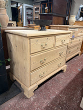 Load image into Gallery viewer, An authentic stripped satinwood chest of drawers, restored to reveal its natural wood grain. This vintage piece features two short dovetail-jointed drawers above two generous long drawers—ideal for bedroom or hallway storage.&nbsp;As a stripped vintage find, the natural finish showcases the wood's character, including minor marks that reflect its history. A protective coat of wax will enhance durability and bring out the satinwood's warm tones.&nbsp;

Delivery Available

Overall Dimensions

91cm wide x 48cm
