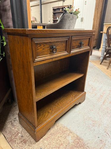 This beautiful oak bookcase is sturdy and generally in great shape. It shows some signs of use with minor marks, but nothing serious. It features two small drawers with dovetail joints and one shelf that can be removed.

Delivery Available

Overall Dimensions

75cm wide x 26cm deep x 81cm high
