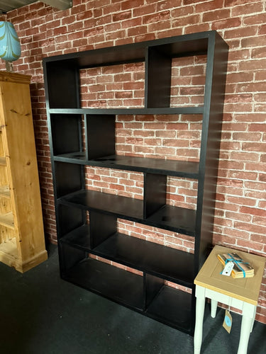 This black shelving unit bookcase combines practical storage with a sleek, classic design. Structurally sound and in good overall condition, it offers sturdy shelves perfect for books, decor, or everyday essentials. While it is used and shows some minor marks, these do not detract from its overall appeal or functionality. Its timeless style and solid construction make it a happy addition to any room.

Delivery Available

Overall Dimensions

120cm wide x 35cm deep x 180.5cm high
