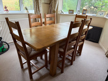 Load image into Gallery viewer, Timeless oak dining table with extendable functionality. Features solid construction and versatile design—use the full length for entertaining or remove the two extension leaves for a more compact fit. Minimal surface marks consistent with use are present. Ideal for adapting to your space and lifestyle.&nbsp;

Delivery Available

Overall Dimensions

168cm long x 133cm wide x 78cm high

extended : 203cm long

