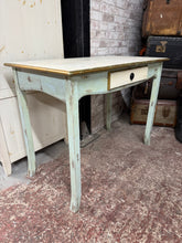 Load image into Gallery viewer, This distressed desk features a weathered painted finish that adds vintage appeal to any room. Built to last with sturdy construction, it includes a front drawer for storage. Perfect for home offices, bedrooms, or any space needing character and function.

Delivery Available

Overall Dimensions

100cm wide x 53cm deep x 76cm high

