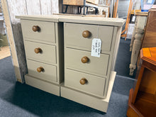 Load image into Gallery viewer, A charming pair of solid pine bedside tables that combine durability with timeless appeal. Each unit features three dovetail-jointed drawers, offering practical storage solutions for your bedroom essentials. While these pieces showcase a few minor surface marks, they remain in excellent working condition and ready to enhance your space with rustic warmth and functionality.

Delivery Available

Overall Dimensions

40cm wide x 48cm deep x 64cm high&nbsp;

