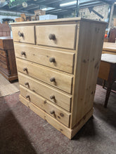 Load image into Gallery viewer, This beautiful large solid pine chest of drawers is sturdy and generally well maintained. It has been stripped back and could shine even more with a coat of wax for added protection. Featuring two smaller drawers with dovetail joints above four larger ones, it provides plenty of storage space.

Overall Dimensions

92.5cm wide x 51cm deep x 114cm high

DELIVERY AVAILABLE      

For our other items see our website https://fossewayfurniture.co.uk

collection from our shop at CV36 4QZ or purchase online for del
