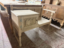 Load image into Gallery viewer, This charming oak telephone seat showcases natural wood grain in its stripped finish, ready for your personal touch with wax if desired. Ideal for entryways and porches, it combines practical seating with concealed storage via its integrated cupboard—perfect for keeping hallway essentials neatly tucked away.

Delivery Available

Overall Dimensions

94cm wide x 41.5cm deep x 77cm high&nbsp;

