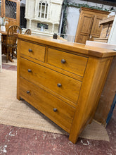 Load image into Gallery viewer, A characterful oak chest of drawers combining solid construction with rustic appeal. Featuring two short dovetail-jointed drawers above two generous long drawers, it offers practical storage with traditional craftsmanship. Light surface marks reflect its pre-loved history and add to its charm. Structurally sound and ready to enhance contemporary interiors.

Delivery Available

Overall Dimensions

99cm wide x 44cm deep x 83cm high

