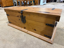 Load image into Gallery viewer, A sturdy pine blanket box offering practical storage for blankets, linens, and household essentials. This pre-loved piece shows honest signs of use with minor surface marks, but remains structurally solid and fully functional. The hinged lid opens to access generous interior space, making it ideal for decluttering bedrooms or living areas.&nbsp;

Delivery Available

Overall Dimensions

94cm wide x 37cm deep x 35cm high
