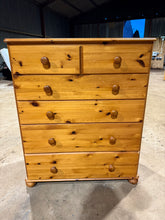 Load image into Gallery viewer, A well-maintained pine chest of drawers offering practical storage solutions. This pre-loved piece features two shallow drawers positioned above four spacious drawers, providing versatile organisation options. While showing natural signs of use with minor surface marks, the construction remains solid and fully functional. An honest, characterful addition to any bedroom or living space.

Delivery Available

Overall Dimensions

88cm wide x 44cm deep x 105cm high

