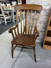 Load image into Gallery viewer, A handsome Victorian grandfather chair crafted from elm and beech, offering authentic period character. Structurally sound, this piece bears the honest patina of age with minor surface marks consistent with its vintage heritage. The legs show gentle bowing typical of antique furniture, particularly the front right, though this does not affect its usability. An excellent choice for collectors seeking genuine Victorian seating with genuine provenance.

Delivery Available

Overall Dimensions

approx : 52cm wid
