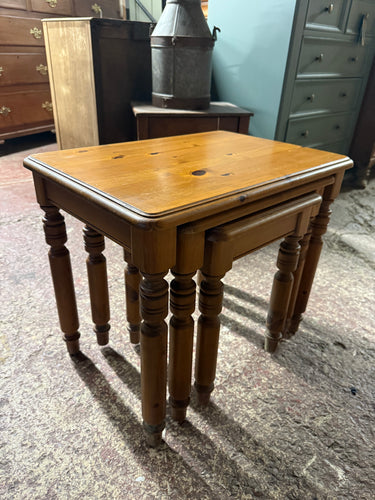 This solid pine nest of tables is sturdy and in good overall shape. While they show some signs of use, these marks don’t impact their functionality. Perfect for keeping by the sofa, they’re great for holding your coffee, books, or small items. The set includes three tables that conveniently nest together for easy storage.

Delivery Available

Overall Dimensions

largest table : 56cm wide x 39cm deep x 47cm high
\