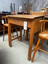 Load image into Gallery viewer, A charming vintage pine school desk with authentic character and patina. Structurally sound and fully functional, this piece bears the honest marks of its history—dents, wear, and weathering that speak to years of use. The hinged top opens to reveal generous storage space inside, perfect for keeping supplies, documents, or treasures organised. An ideal statement piece for period homes, creative studios, or anyone seeking genuine vintage furniture with practical appeal.

Delivery Available

Overall Dimension
