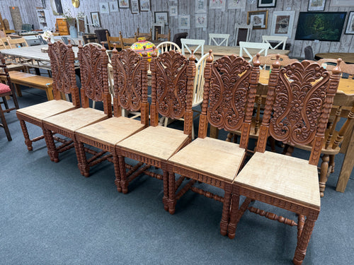 This stunning set of six Indian hardwood dining chairs features beautifully intricate carvings on each piece, adding a unique touch of craftsmanship to your dining area. All chairs are in overall good condition. While the seats are made from plywood, this design detail offers a great opportunity to customise with your preferred seat pads, enhancing both comfort and style to suit your décor.

Overall Dimensions

approx : 46cm wide x 47cm deep x 116cm high

DELIVERY AVAILABLE      

For our other items see ou