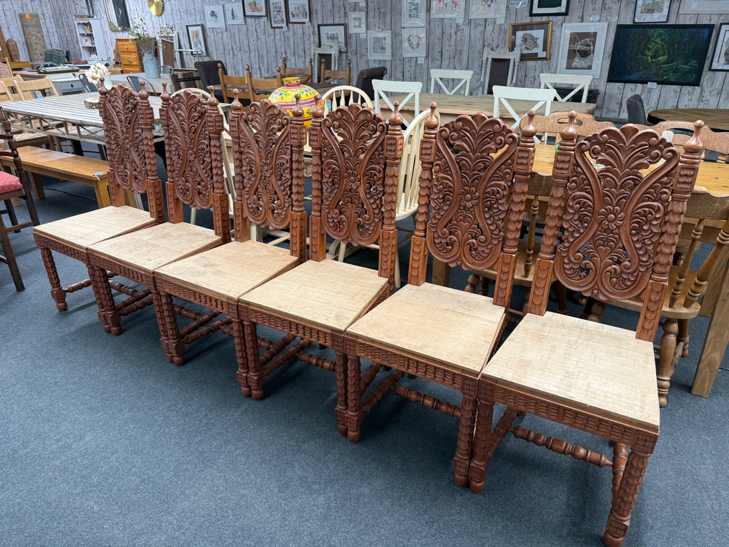 This stunning set of six Indian hardwood dining chairs features beautifully intricate carvings on each piece, adding a unique touch of craftsmanship to your dining area. All chairs are in overall good condition. While the seats are made from plywood, this design detail offers a great opportunity to customise with your preferred seat pads, enhancing both comfort and style to suit your décor.

Overall Dimensions

approx : 46cm wide x 47cm deep x 116cm high

DELIVERY AVAILABLE      

For our other items see ou