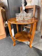 Load image into Gallery viewer, A striking WW2 Gordon Russell utility table featuring distinctive sunburst veneer detailing. This CC41 piece remains structurally sound with authentic period character. As a vintage find, it bears the expected marks of age and use, adding to its authentic appeal and story. Ideal for collectors of mid-century British furniture or anyone seeking a characterful statement table with

Delivery Available

Overall Dimensions

52cm diameter x 48cm high

