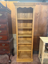 Load image into Gallery viewer, Solid pine narrow bookcase with five removable, adjustable shelves—ideal for maximising storage in compact spaces. Structurally sound and in good overall condition. Shows minor wear consistent with use, but nothing significant. A practical, space-saving solution for any room.

Delivery Available

Overall Dimensions

61cm wide x 36cm deep x 183cm high

